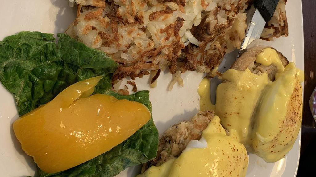Harbor Crab Cake · Two poached eggs top a homemade crab cake and hollandaise sauce.