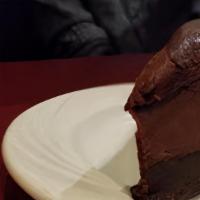 Death By Chocolate Cake · Layers of chocolate mousse, cake and ganache (gluten free)