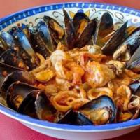 Pasta Pescatora Red · Sautéed Shrimp, Scallops, Mussels, Calamari and Clams in a light red sauce over linguine