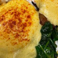 Florence Benedict · Two poached eggs, spinach, bacon on a toasted English muffin and topped with our hollandaise...