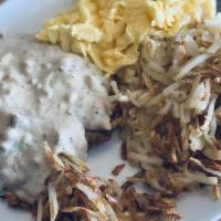 Country Fried Steak Or Chicken · Choice of country-fried steak or chicken, topped with our country gravy, two eggs and hash b...
