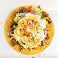  Tostada · Only One Tostada with Beans,Meat, Shredded Cheese,Lettuce,Tomato,Onion,Cilantro and Sour Cre...