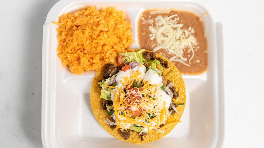  Tostada Plate · Only One Tostada with Beans,Meat, Shredded Cheese,Lettuce,Tomato,Onion,Cilantro and Sour Cream ONLY