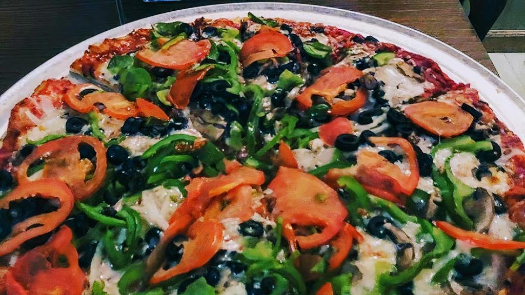 The Veggie Pizza · mushrooms, onions, black olives, green peppers, and fresh sliced tomato.