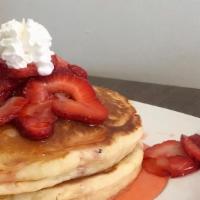 Strawberry Pancakes · Chef crafted pancakes topped with fresh strawberries, homemade strawberry syrup and, whipped...