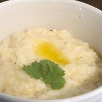 Southern Style Grits · Gourmet Southern style grits, cooked to perfection topped with butter salt and pepper.