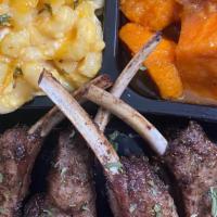 Jerk Lamb Chop Dinner · Choice of two sides.