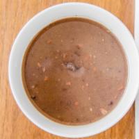 Sopa De Alubias Negras · Spanish style black bean soup with Serrano Ham. gf