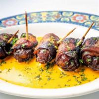 Dátiles Con Tocino · Gluten-free. dates wrapped in applewood smoked bacon served with red pepper butter sauce.