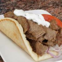 Gyro On Pita · Gyro on a Pita Served with Onions, Tomatoes, and Tzatziki Sauce.   Add fries for an addition...