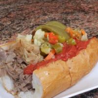 Italian Beef · Fresh Italian Beef on French Bread Served with Grilled Onions, Hot Peppers, Sweet Peppers, a...