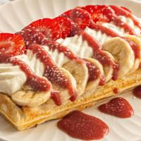 Strawberry Banana Waffle · Cream cheese whipped cream, fresh strawberries & bananas, Strawberry glaze, & powdered sugar