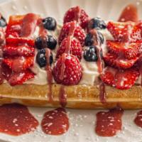 Berries & Cream Waffle · Cream Cheese whipped cream, Mixed fresh berries, Strawberry glaze, powdered sugar