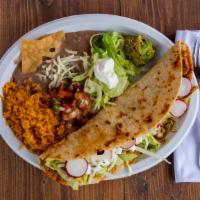 Quesadilla Platter · A large corn tortilla filled with your choice of meat, lettuce, cream and cheese served with...