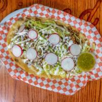 Huaraches  · A large corn tortilla Topped with your choice of meat, beans,  lettuce, cream and cheese.