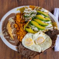 Chilaquiles · 2 Eggs, cecina, rice and beans