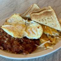 Corned Beef Hash & Eggs · With hash browns or pancakes.
