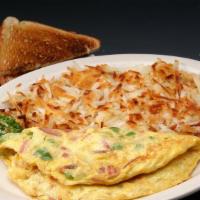 Western Omelette · Three eggs mixed with ham, american cheese, green peppers and onion.