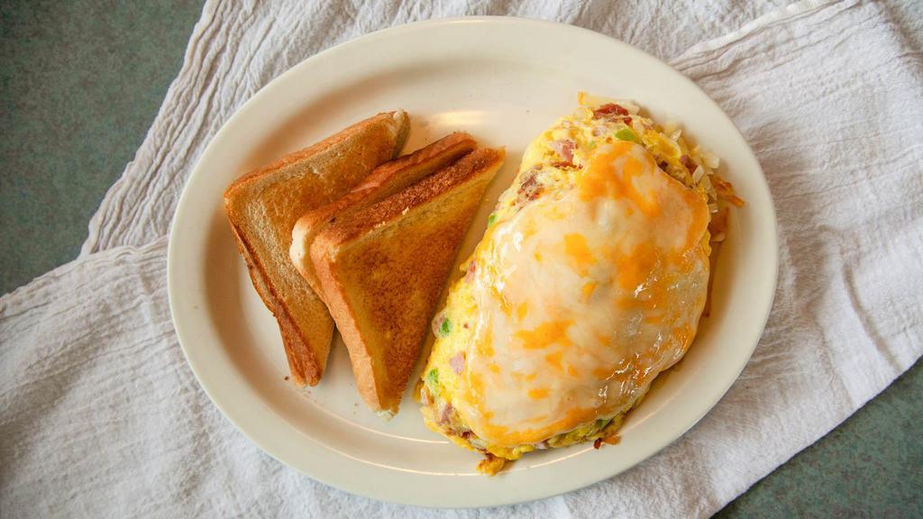 Rancher'S Omelette · Mixed with ham, onion, green peppers and bacon; stuffed with hash browns and smothered with cheese.