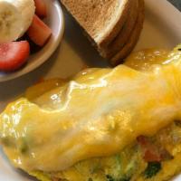 Fresh Veggie Omelette · Stuffed with broccoli, zucchini, onions, peppers, mushrooms and carrots. Topped with jack an...