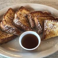 Texas French Toast · Six halves of golden brown french toast.