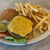 Cheeseburger With Fries · Topped with american cheese and served with lettuce, tomato and pickle.