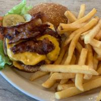 Bacon Cheeseburger With Fries · Topped with bacon and american cheese. Served with lettuce, tomato and pickle.