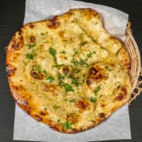 Garlic Naan · Naan topped with garlic.