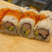 Deluxe California Roll · Tempura Flakes over California roll with Sweet chili sauce.