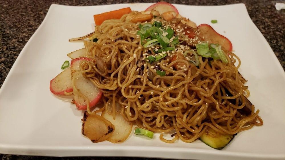 Yaki Seafood Soba · Stir fried soba noodles with fish cake, shrimp and vegetables.