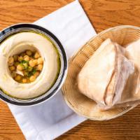 Hummus Large · Pureed chick peas blended with tahini, and lemony sauce