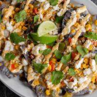 Street Corn Nachos · Blue corn chips, melted cheese, roasted corn & bell peppers, spicy aioli, queso fresco & cil...