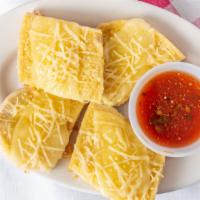 Garlic Cheese Bread · Our delicious garlic bread topped with plenty of melted provolone cheese.