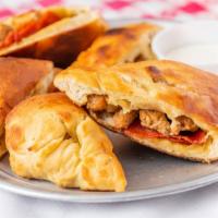 Calzone Supreme · Buttery garlic toasted calzone filled with all the best!  Pepperoni,  Sausage, Onion, Bell P...