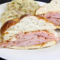 Bavarian Ham And Cheese · Thinly sliced smoked ham grilled, topped with melted Swiss, served on a freshly toasted pret...