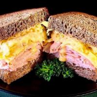 Honey Roasted Turkey Reuben · Thinly sliced, tender, honey roasted turkey breast. Topped with Schmidt’s sweet kraut, melte...