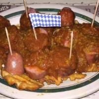 Currywurst · German Street Food! Served with special curry sauce over knockwurst bites und fries.