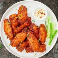 Classic Crispy Wings · Fresh chicken wings fried until golden brown.