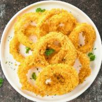 All Over The Onion Rings  · (Vegetarian) Sliced onions dipped in a light batter and fried until crispy and golden brown.