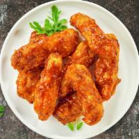 Buffalo Bender · Chicken tenders breaded and fried until golden brown before being tossed in buffalo sauce.