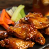 Bone-In Honey Hot Wings · 8 pieces honey hot wings - medium heat. Come with 8  classic style bone-in wings, carrots an...