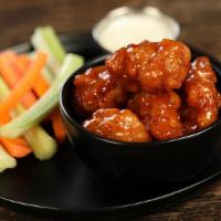 Boneless Honey Hot Wings · 8 pieces honey hot wings - medium heat. Come with 8  classic style bone-in wings, carrots an...