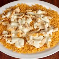 Arroz Con Pollo · A bed of rice, with chicken strips. Topped with choice of ranchero sauce or cheese sauce. Se...