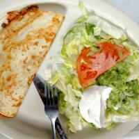 Quesadilla Rellena · A flour tortilla grilled and stuffed with shredded beef or chicken or mushrooms, beans and c...