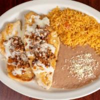 Chori Pollo · Grilled chicken breast. Topped with chorizo mexican sausage and cheese sauce. Served with ri...