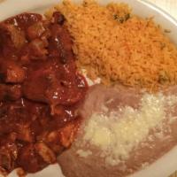 Chile Colorado · Chicken, pork or beef tips with red sauce. Served with rice, beans and tortillas.