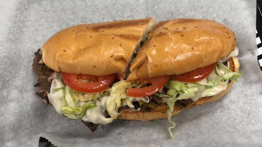 Super Philly Cheesesteak · Beef or chicken. Super includes: provolone cheese, onions, green pepper, mayo, lettuce, tomato. Add banana or grilled banana peppers - no charge