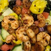 Greek Salad · Served with Black Olives, Cucumbers, Red Onions, Banana Peppers, House Gyro Sauce, Tomatoes