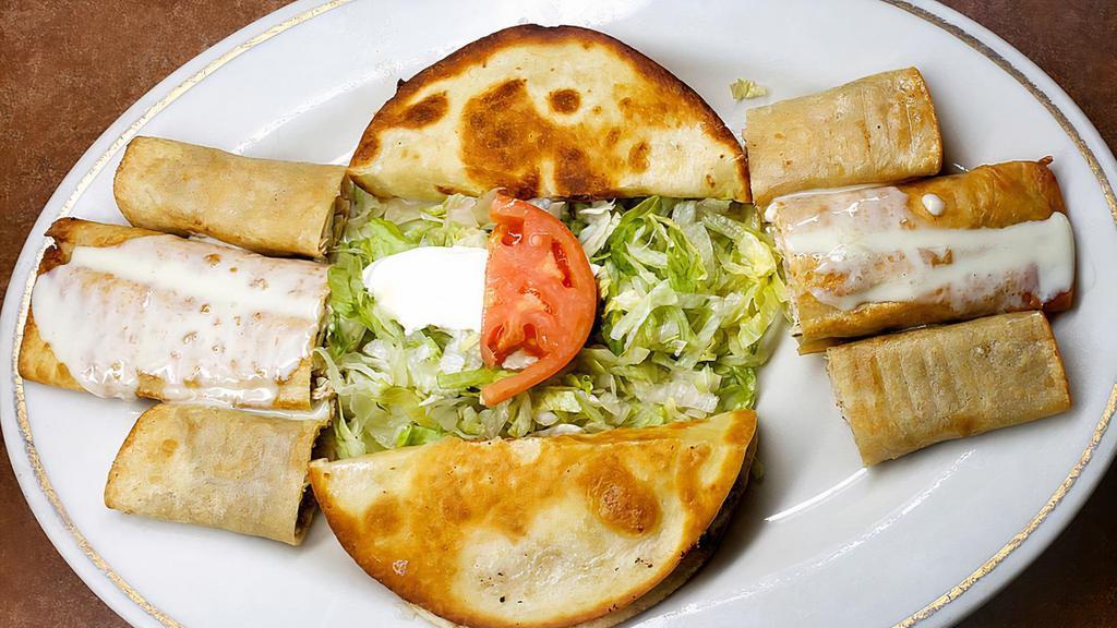 Tradicion Sampler · Perfect for a group! 1 chimichanga, 4 quesadilla slices, and 2 taquitos. Everything comes with your choice of beef or chicken. Served with sour cream, guacamole, and lettuce.
