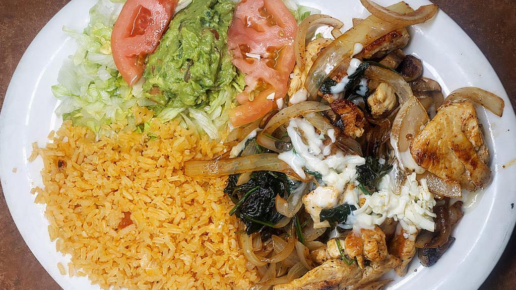 Popeye Grilled Chicken · Cooked with onions, spinach, and mushrooms topped with cheese. Served with rice and guacamole salad.